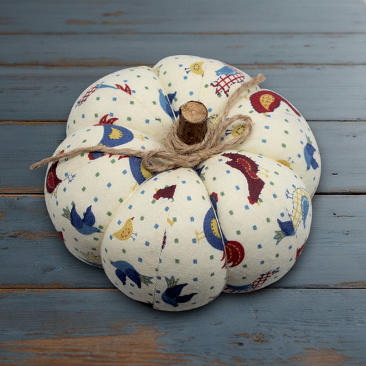 Decorative fabric pumpkin with a folk art bird design