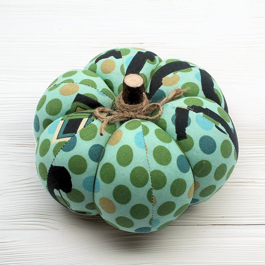 Decorative fabric pumpkin with a blue and green dot pattern