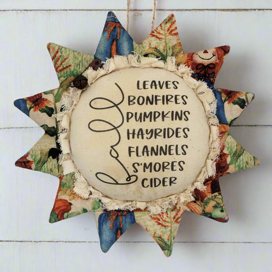 Primitive sunflower ornament with a list of fall favorites printed on the center