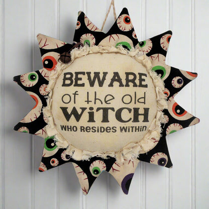 Primitive fabric sunflower ornament for Halloween warning to avoid the old witch who resides here