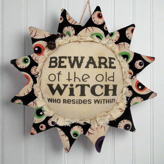 Primitive fabric sunflower ornament for Halloween warning to avoid the old witch who resides here