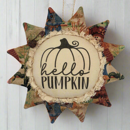 Primitive fabric sunflower ornament with the greeting 'hello pumpkin'