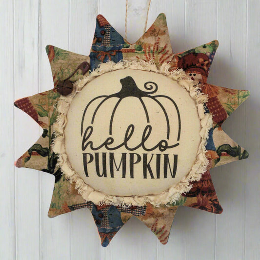 Primitive fabric sunflower ornament with the greeting 'hello pumpkin'