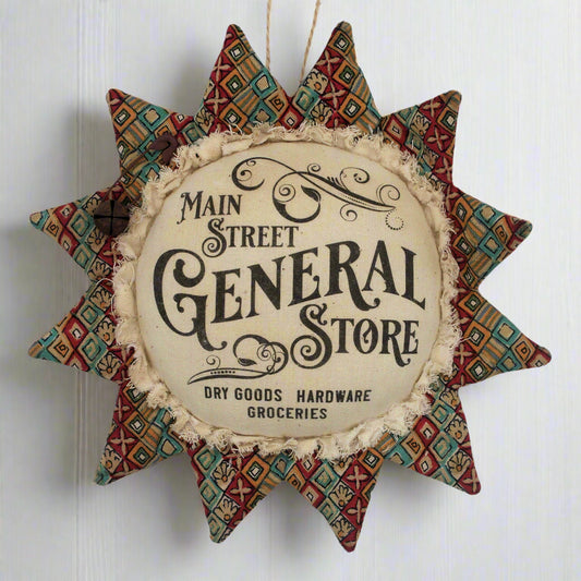 Primitive fabric sunflower ornament with an advertisement for the main street general store
