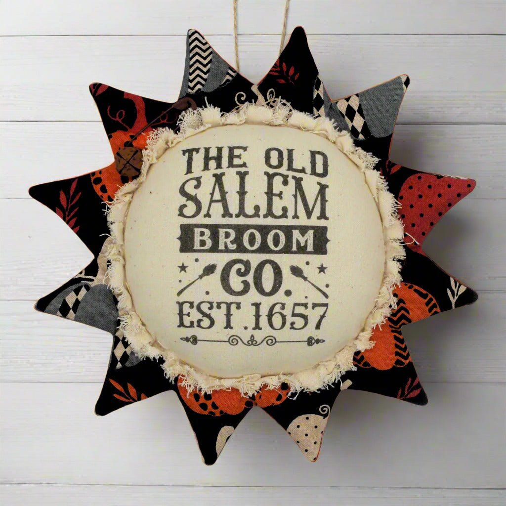 Primitive fabric sunflower ornament advertising for the Old Salem Broom Company