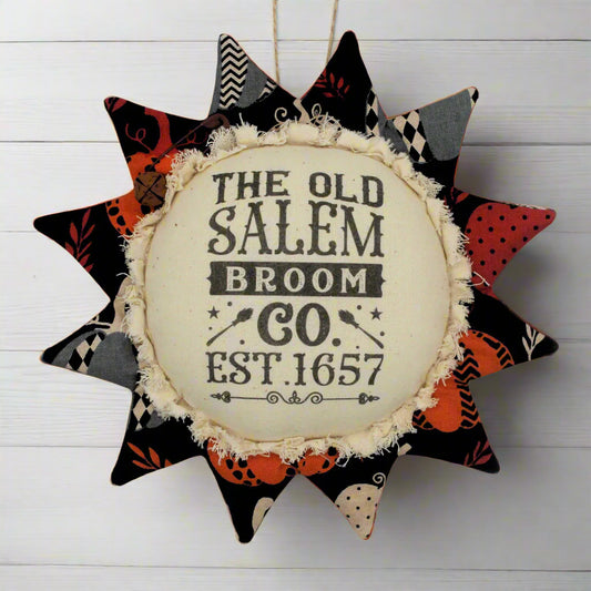Primitive fabric sunflower ornament advertising for the Old Salem Broom Company