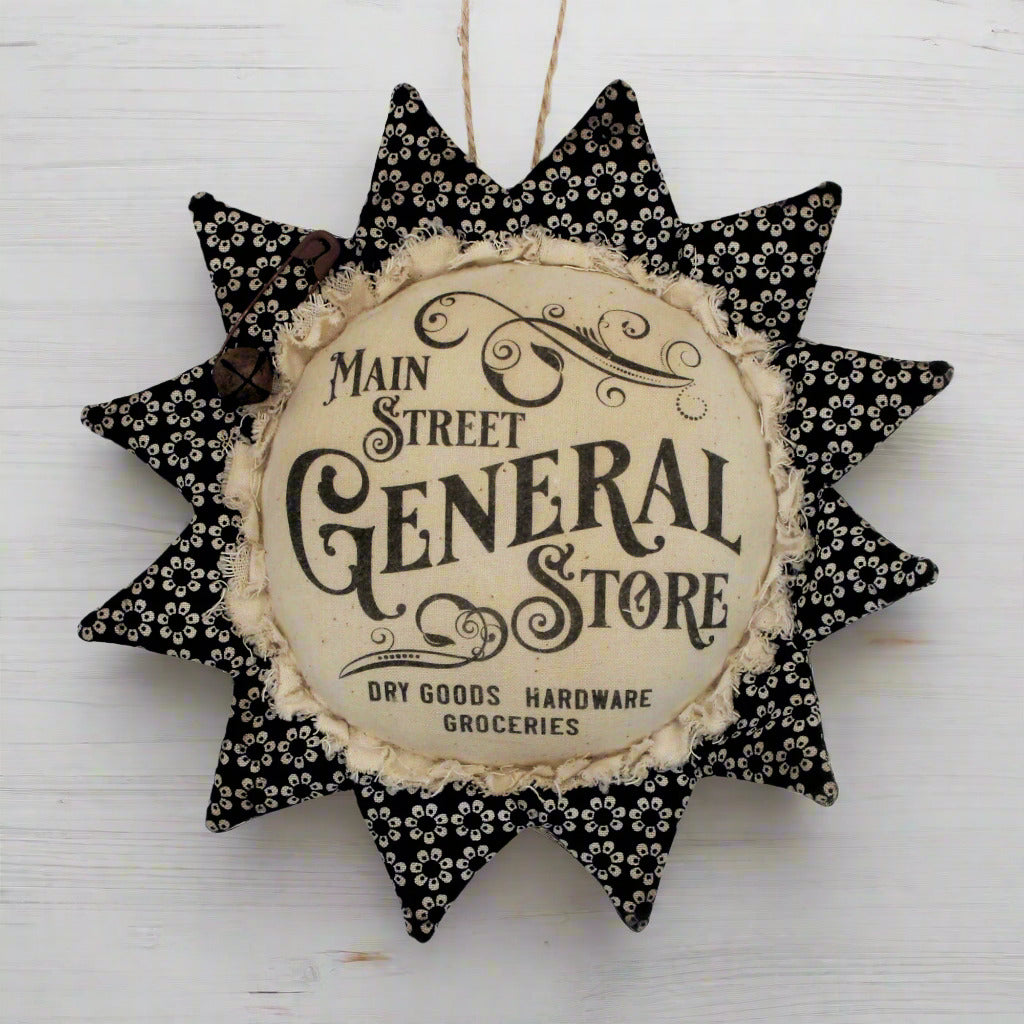 Primitive fabric sunflower ornament with an advertisement for the Main Street General Store