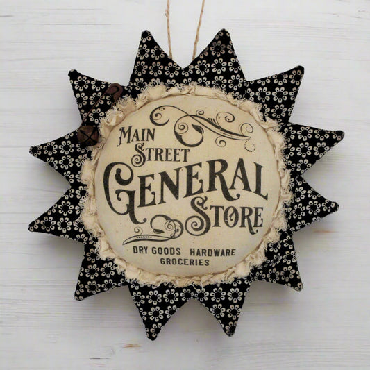 Primitive fabric sunflower ornament with an advertisement for the Main Street General Store