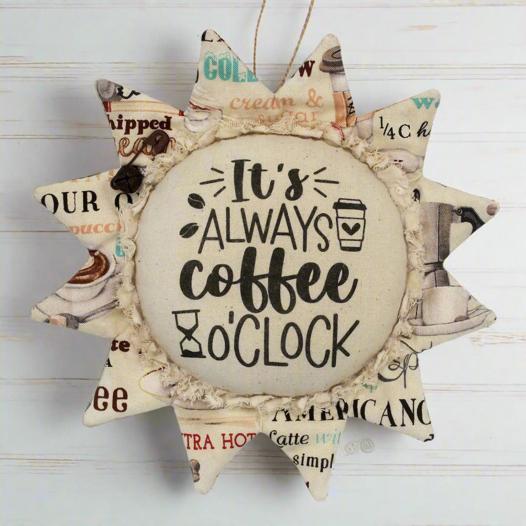 Primitive fabric sunflower ornament with the text 'It's always coffee o'clock'