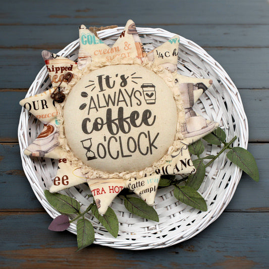 Primitive fabric sunflower ornament with the text 'It's always coffee o'clock'