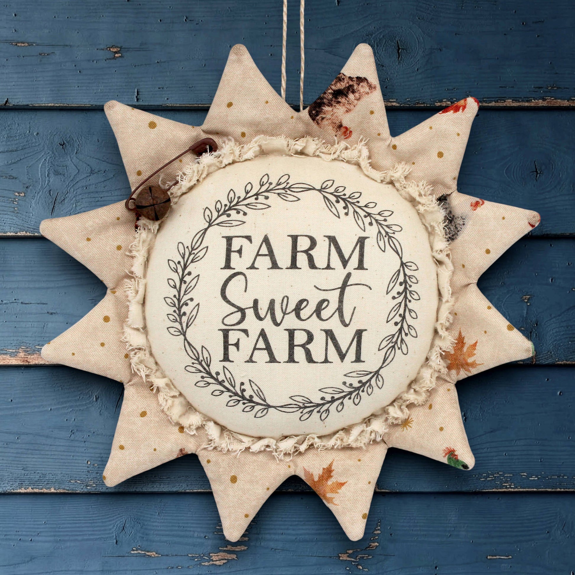 Decorative fabric sunflower sign with 'Farm Sweet Farm' text on a white background