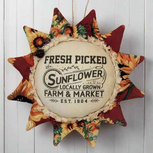 Primitive fabric sunflower ornament with an advertisement for a farm market