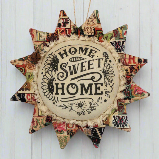 Primitive fabric sunflower ornament with Home Sweet Home printed on its center