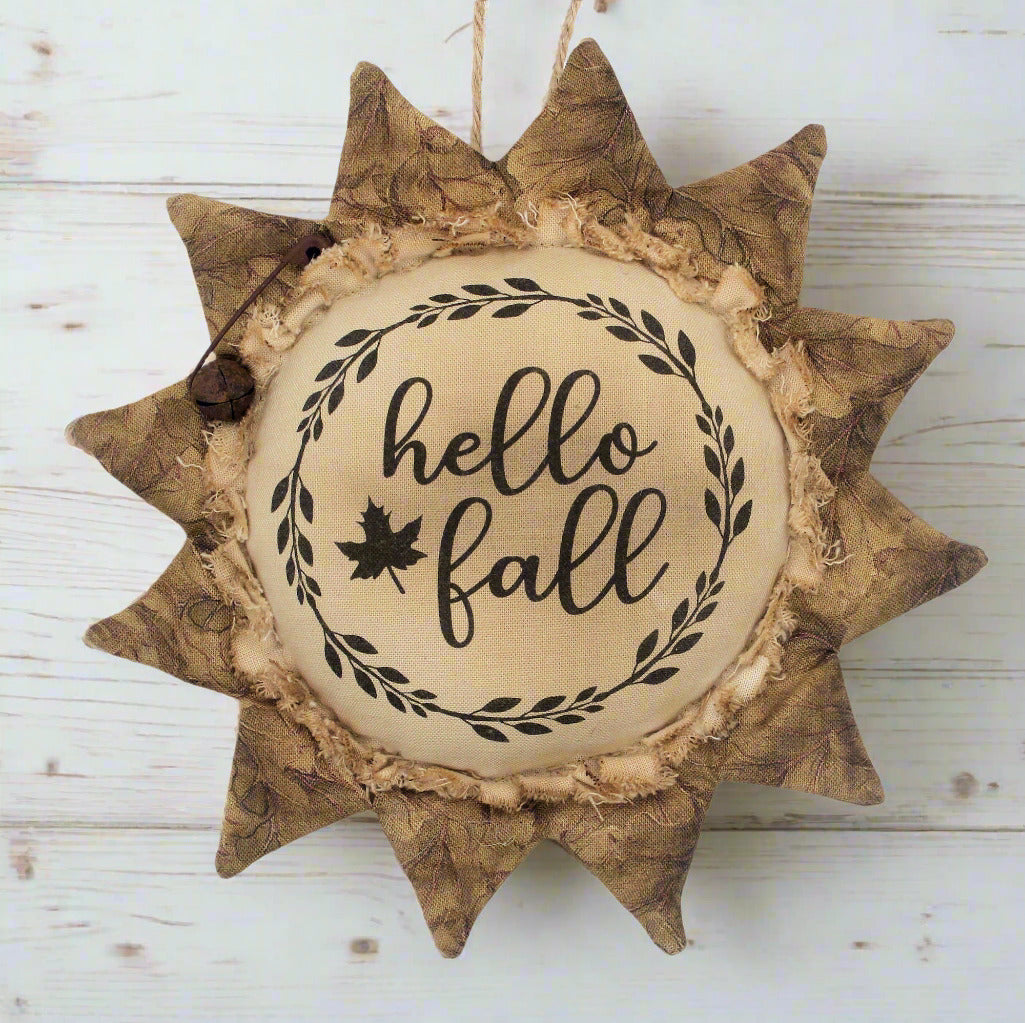 Primitive sunflower ornament with the greeting Hello Fall