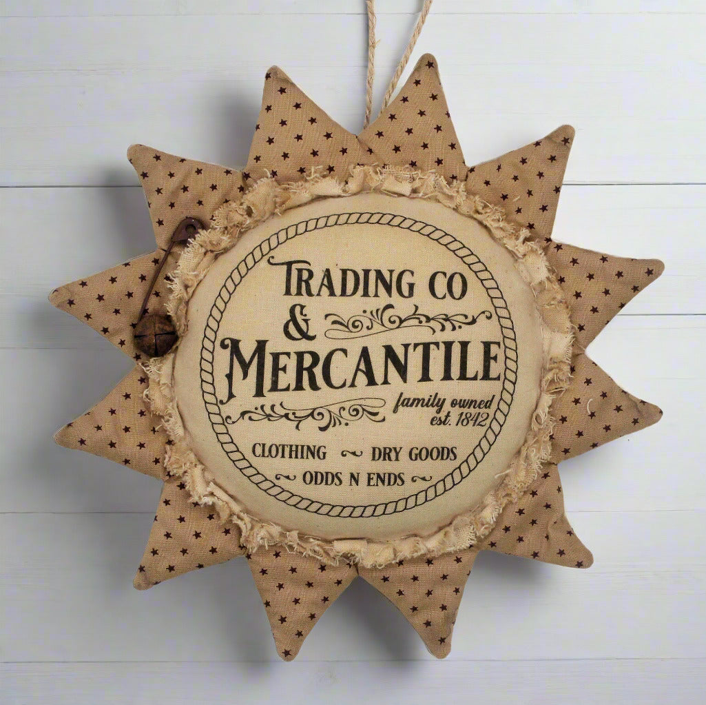 Primitive sunflower ornament with an advertisement for a trading company and mercantile
