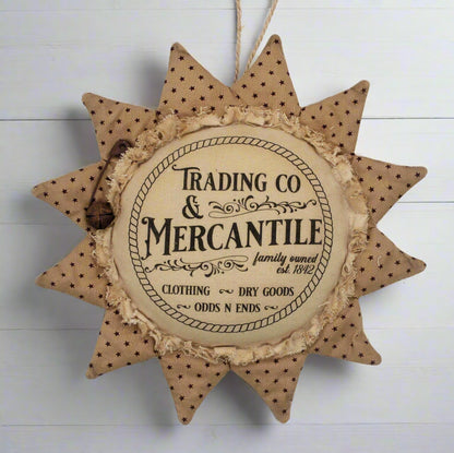 Primitive sunflower ornament with an advertisement for a trading company and mercantile