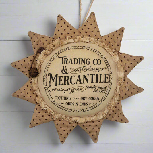 Primitive sunflower ornament with an advertisement for a trading company and mercantile