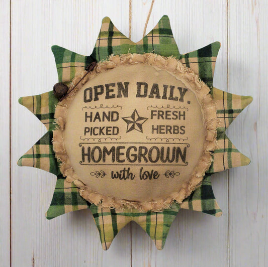 Primitive sunflower ornament with an advertisement for fresh herbs
