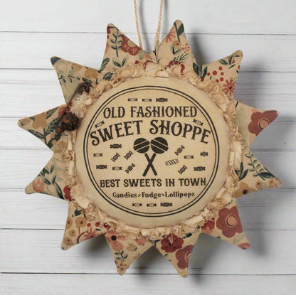 Primitive sunflower ornament with an advertisement for an old fashioned sweets shop
