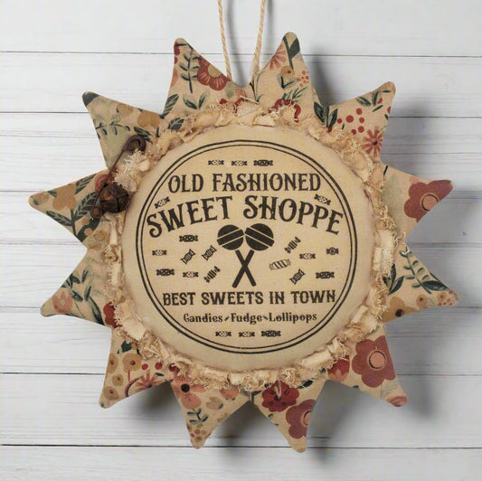 Primitive sunflower ornament with an advertisement for an old fashioned sweets shop