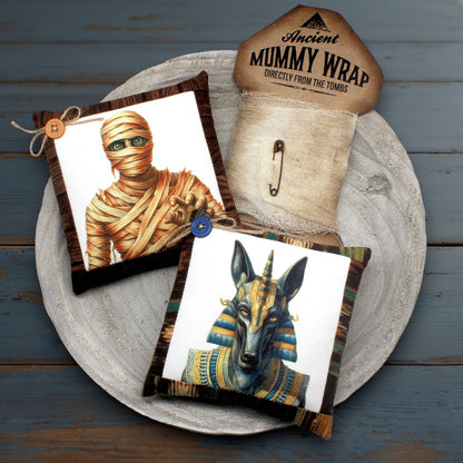 Mummy-themed products including a wrap and decorative items on a wooden surface