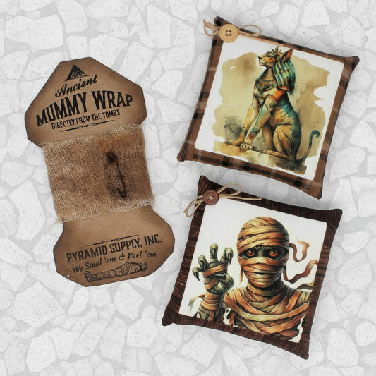 Decorative items with Egyptian-themed designs on a white background