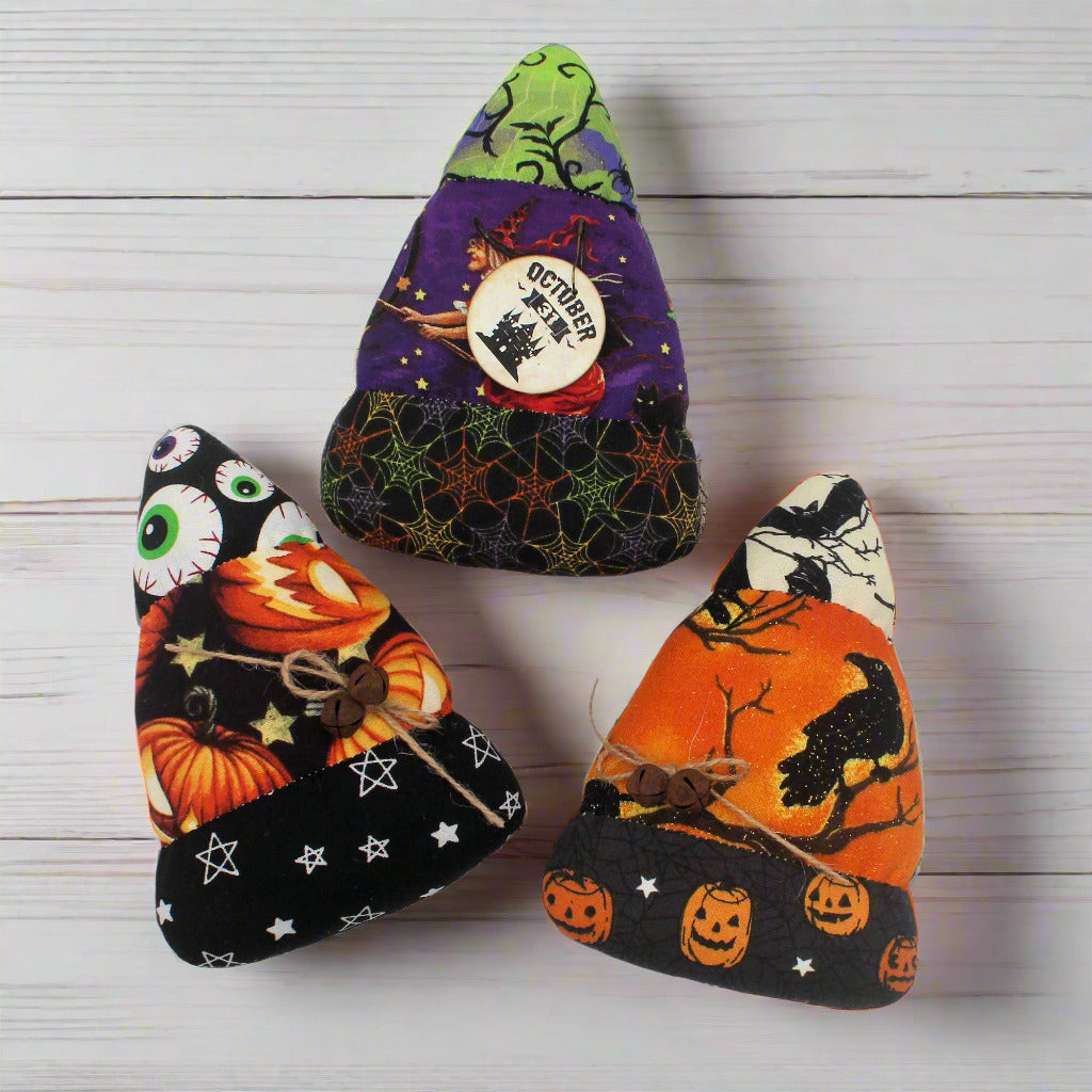 Set of three colorful Halloween candy corn bowl fillers
