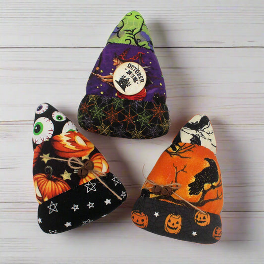Set of three colorful Halloween candy corn bowl fillers