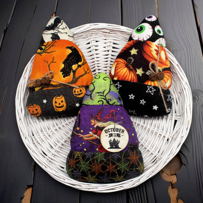 Set of three candy corn bowl fillers made from Halloween print fabrics