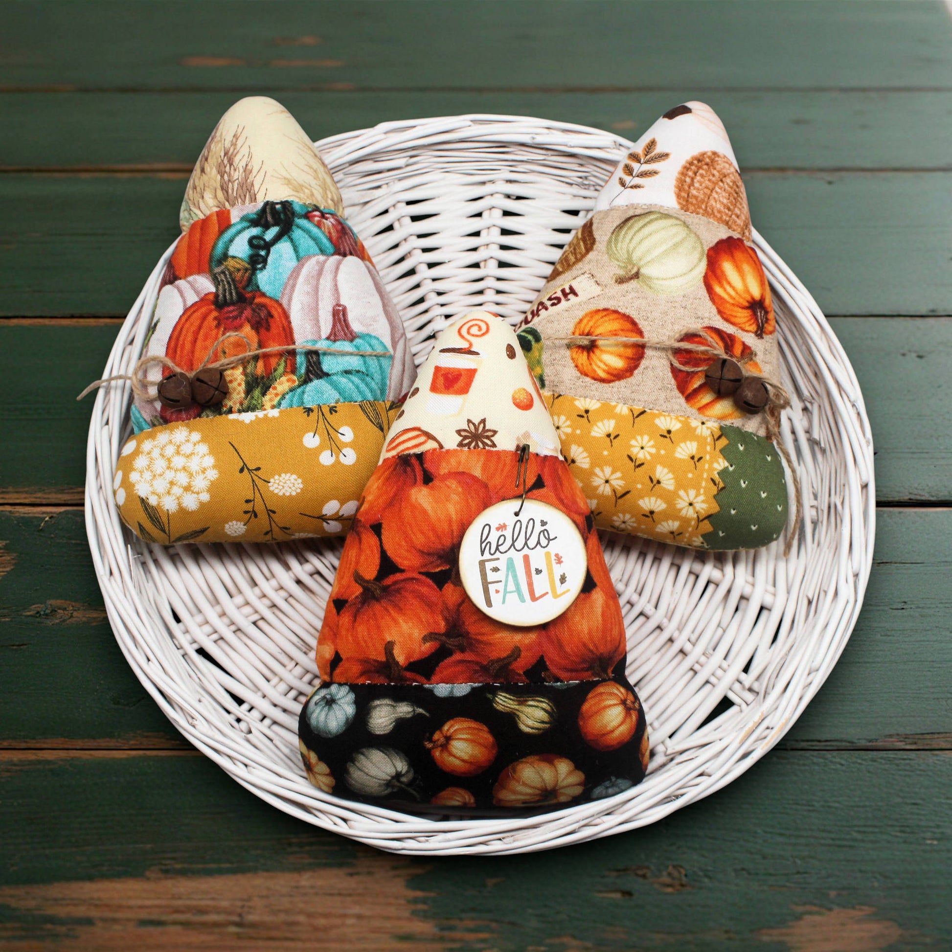 Set of three colorful candy corn bowl fillers in fall-themed fabrics