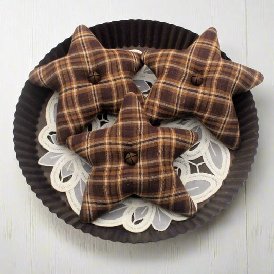 Brown mix homespun star bowl fillers on a decorative plate with a white background