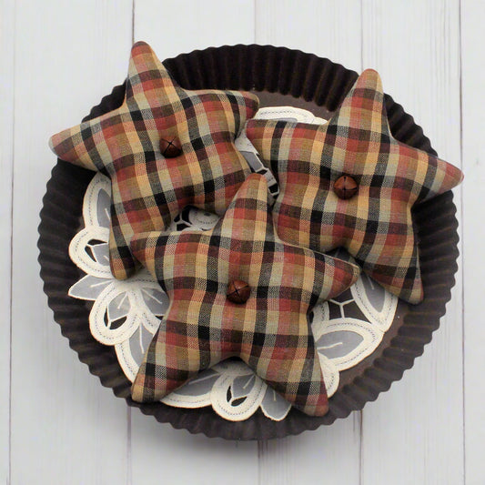 Homespun stars bowl fillers on a decorative plate with a white background