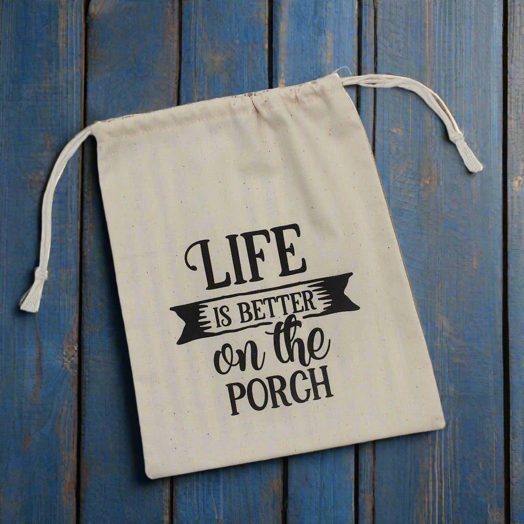 Muslin drawstring bag with 'Life is better on the porch' text
