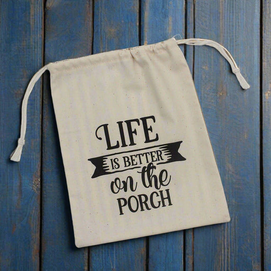 Muslin drawstring bag with 'Life is better on the porch' text