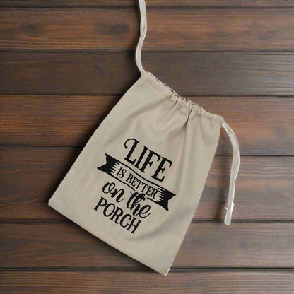 Muslin drawstring bag with 'Life is better on the porch' text