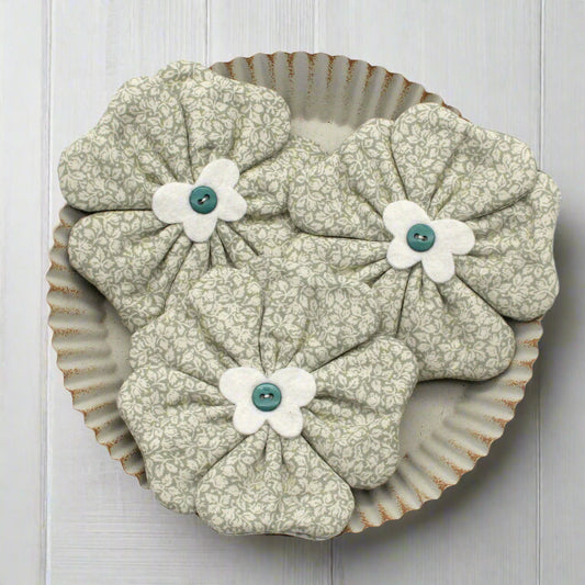 Fabric flower bowl fillers in a light sage green floral pattern