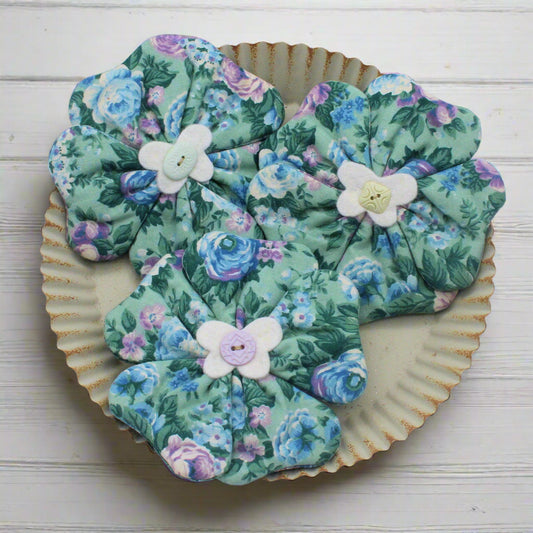 Blue and green flower bowl fillers with buttons in the centers