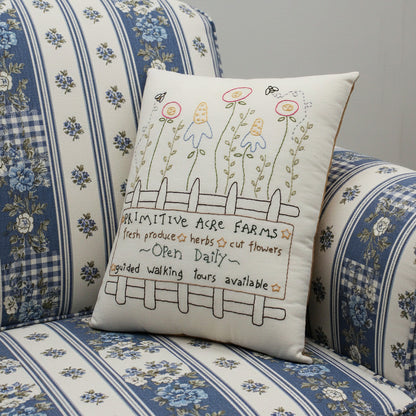 Hand-stitched decorative pillow with a primitive flower farm design