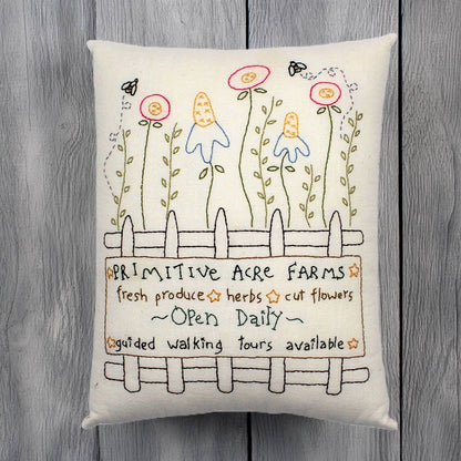 Hand-stitched decorative pillow with a flower garden design