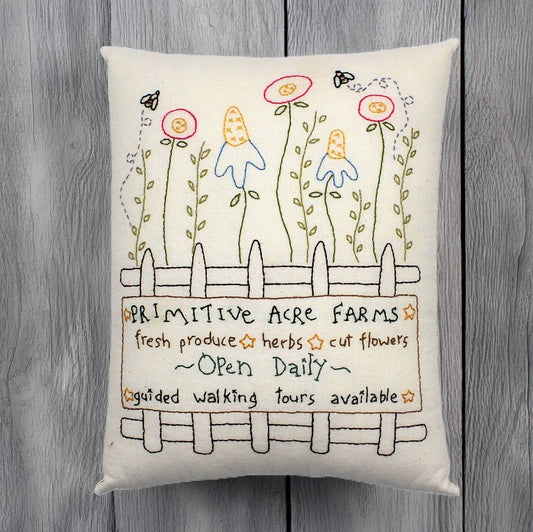 Hand-stitched decorative pillow with a flower garden design