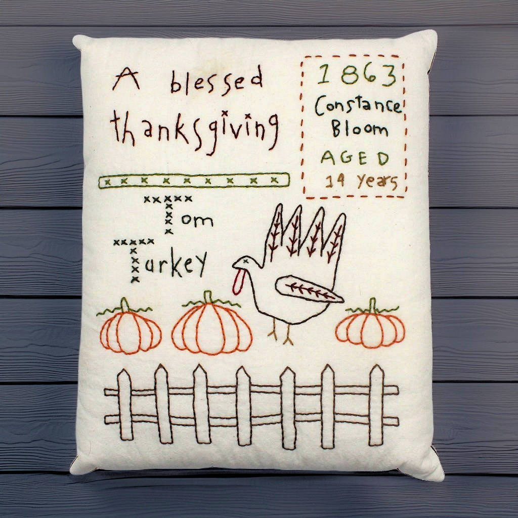 Hand-stitched decorative pillow with a Thanksgiving turkey design