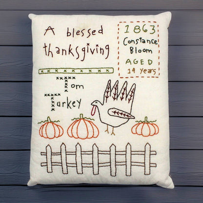 Hand-stitched decorative pillow with a Thanksgiving turkey design