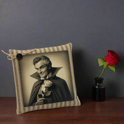 Decorative pillow with a vintage-style portrait of a handsome vampire holding a rose