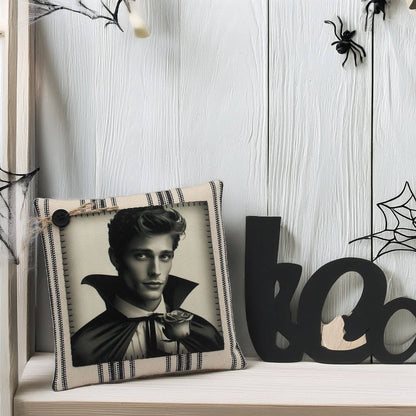Decorative pillow with a portrait on a shelf with Halloween decorations.