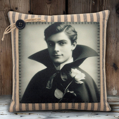 Decorative pillow with a vintage-style portrait of a handsome young vampire in a dark cape on a white background