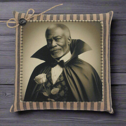 Decorative pillow with a vintage-style portrait of a handsome vampire in a cape