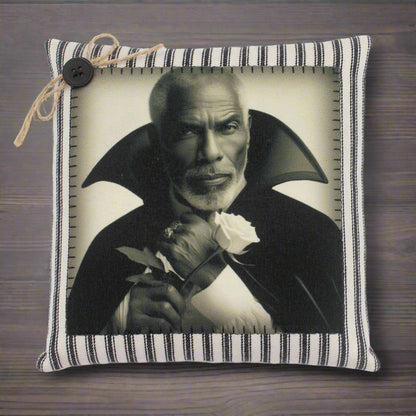 Pillow with a black and white portrait of a handsome vampire holding a rose on a striped background