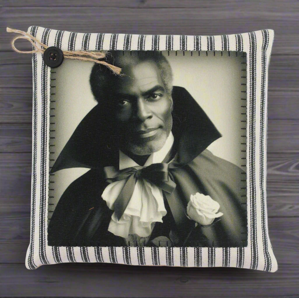 Decorative pillow with a black and white portrait of a handsome vampire in a cape and bow tie