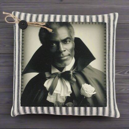Decorative pillow with a black and white portrait of a handsome vampire in a cape and bow tie