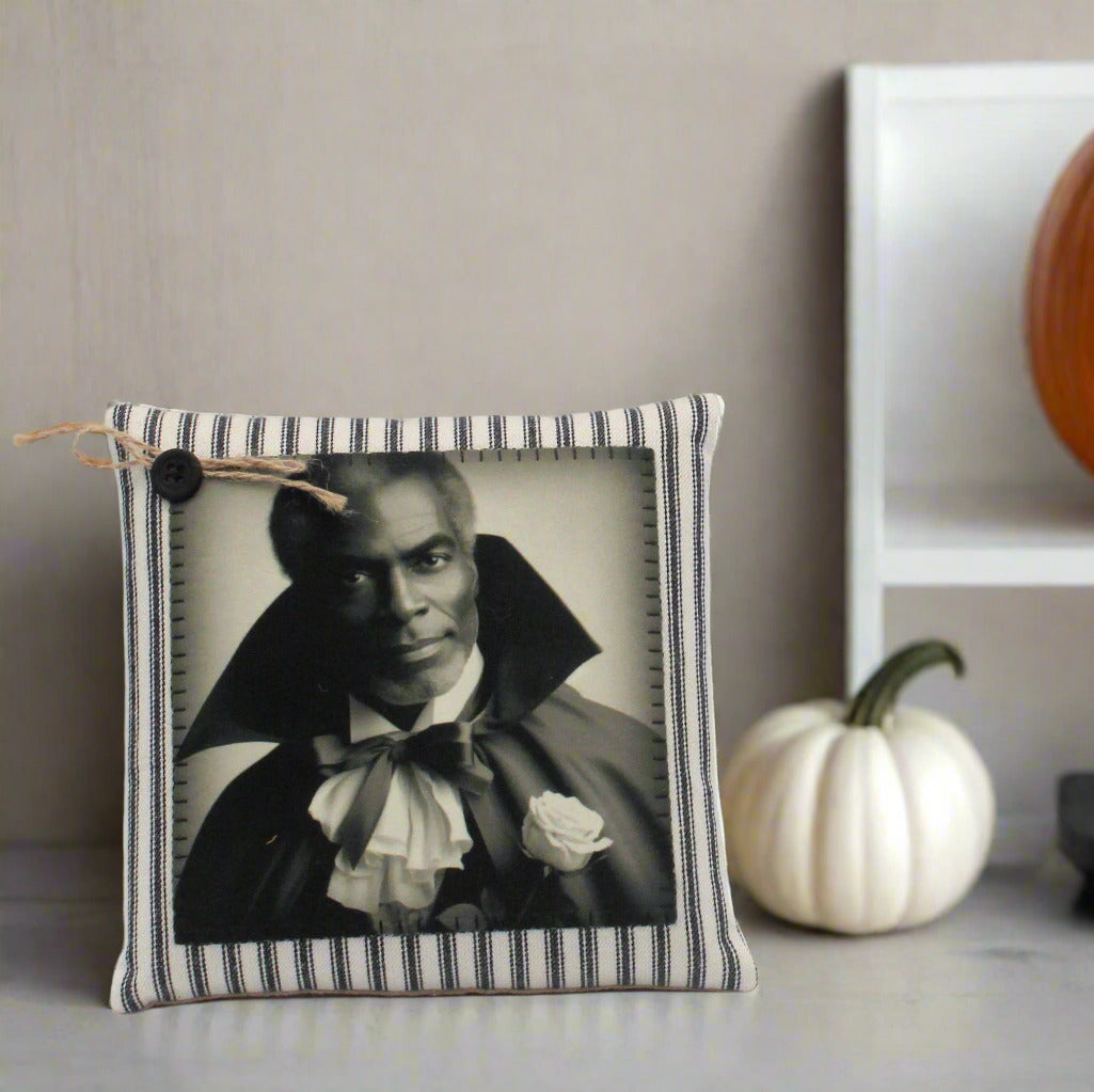 Pillow tuck with a striped border containing a black and white portrait of a handsome vampire